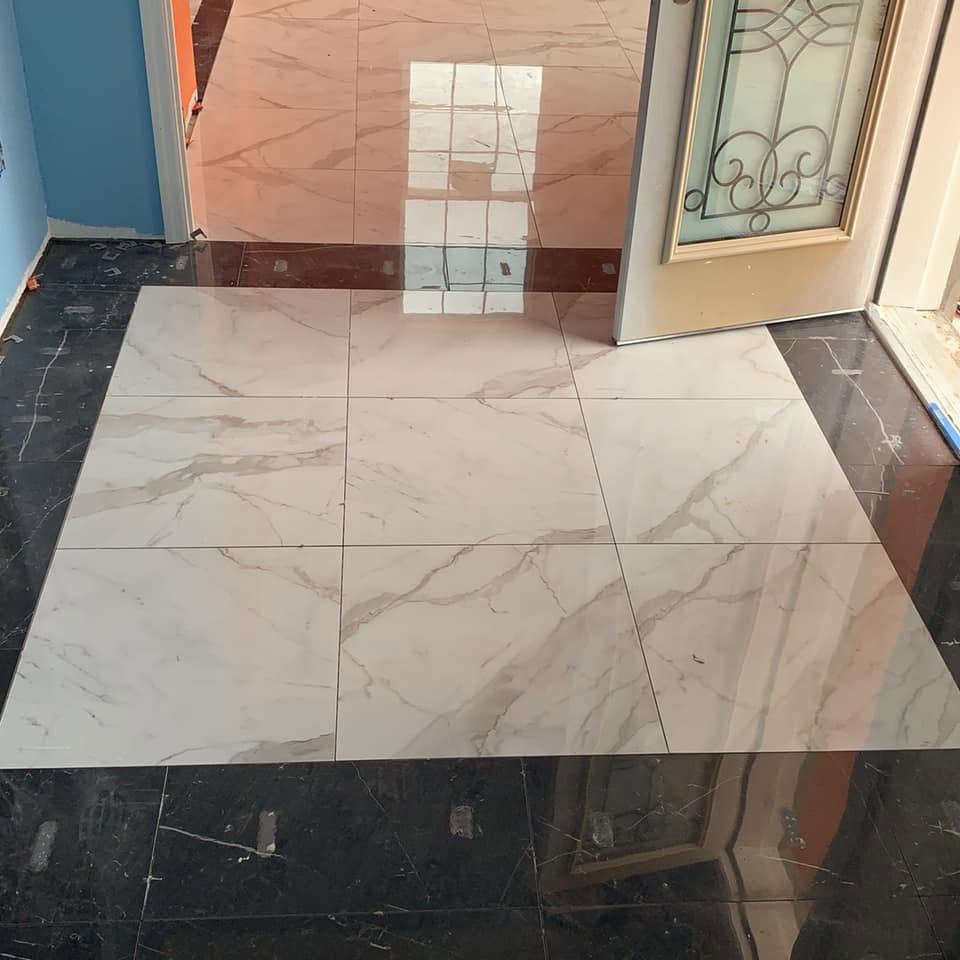 Polished marble floor installed by Mederus Services Inc. at a home's entryway